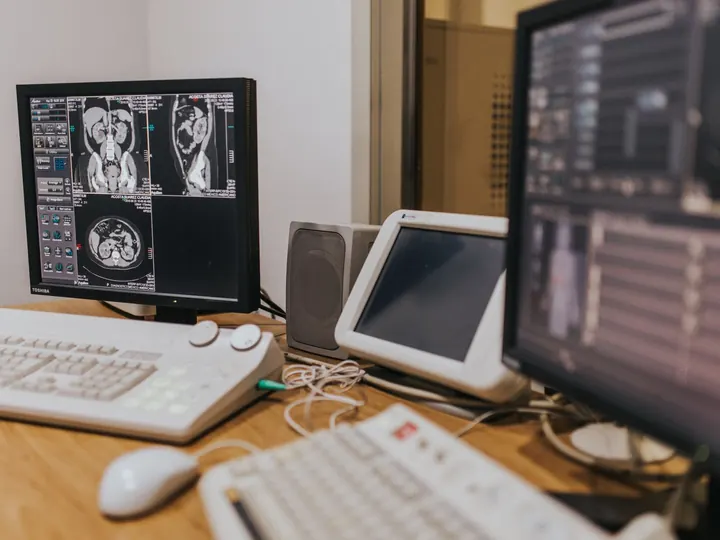 Medical imaging scans on monitors in a clinic